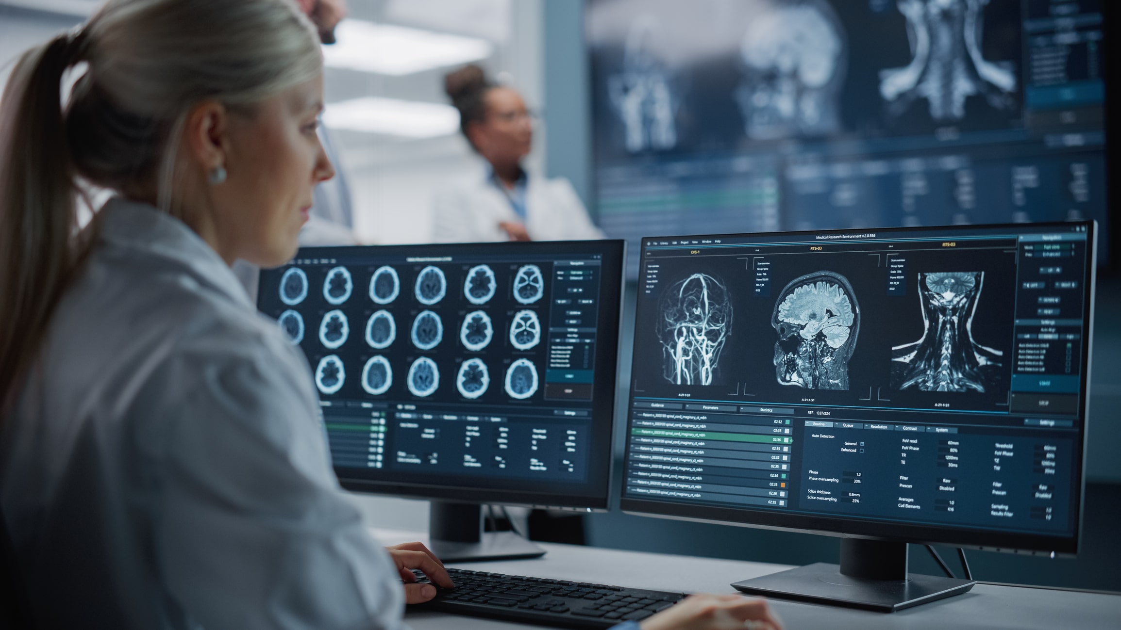 a woman looking at a computer screen with a picture of a brain on it