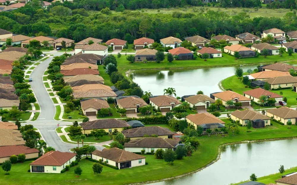 Aerial view of tightly packed waterfront homes at The Villages, Florida.